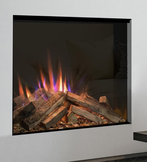 Modern living room featuring a built-in electric fire with realistic log-effect flames, set beside a neutral sofa and dark wood coffee table.