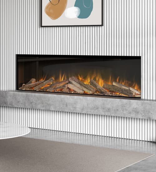 A wide built-in electric fire with a realistic log-effect fuel bed and flames, set within a contemporary grey wall and surrounded by minimalist furnishings.