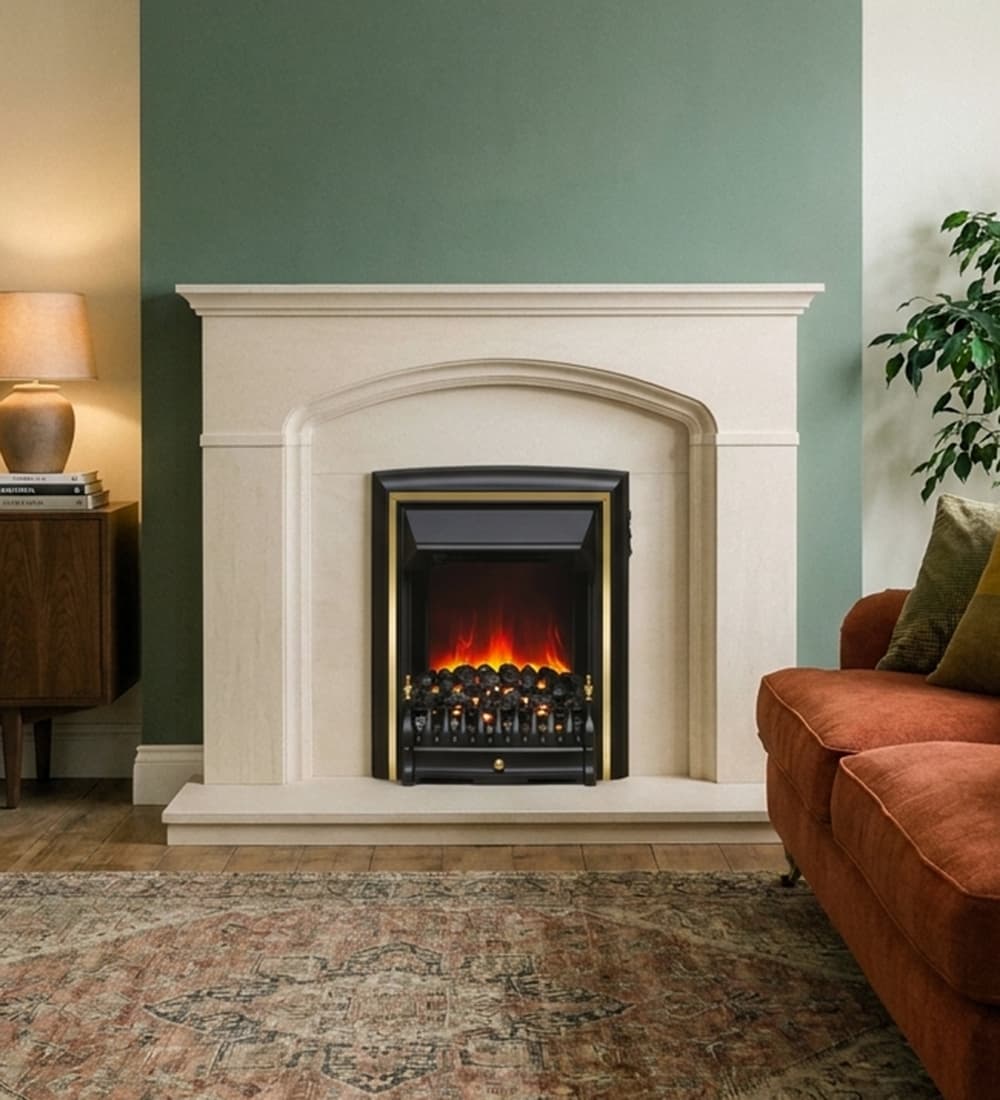 Flare Comet inset electric fire in brass shown with the Cantebury limestone fireplace in a uk from on a sage coloured chimney breast