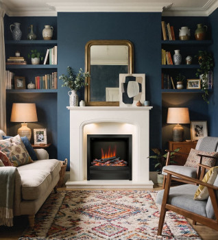 Flare Novus 22 black nickel electric fire with Elgin & Hall Viena White Micro Marble Fireplace in a dark blue living room.
